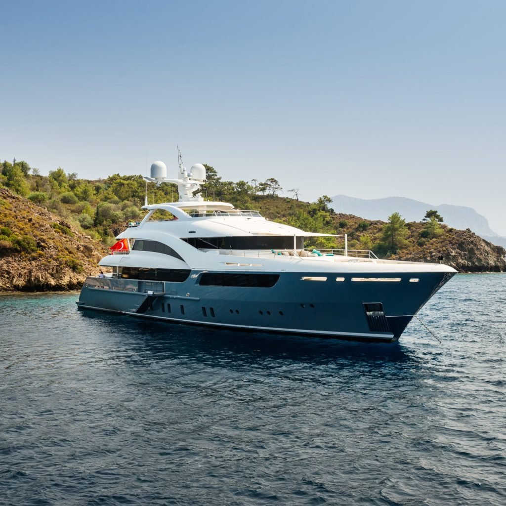 luxury big yacht stay in the sea around the island on a background of the sky